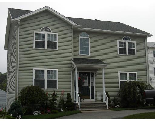206 Manchester Street Fall River, MA 02721 - Photo 4 of 12 a front view of a house with plants