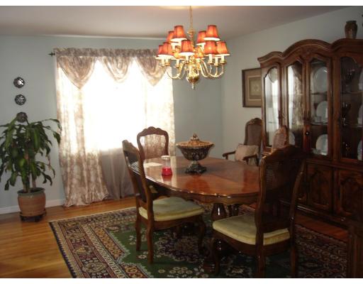 206 Manchester Street Fall River, MA 02721 - Photo 10 of 12 a view of a dining room with furniture and chandelier