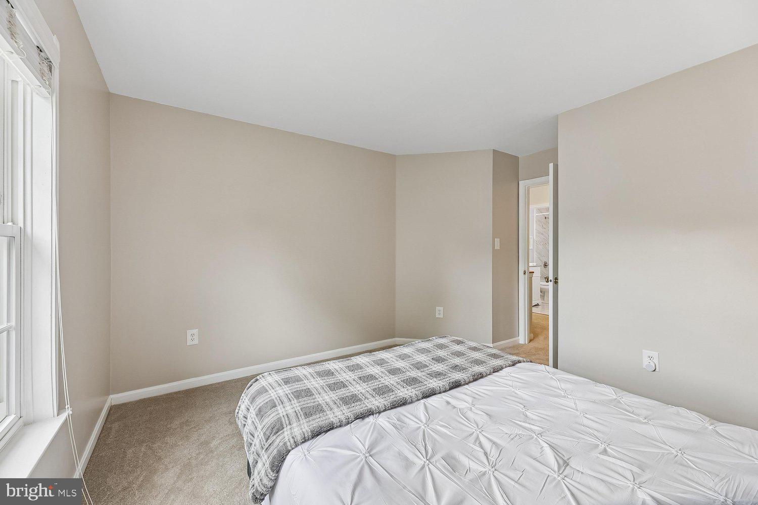 3707 Turn Back Trail Triangle, VA 22172 - Photo 39 of 55 a bedroom with a bed and a window