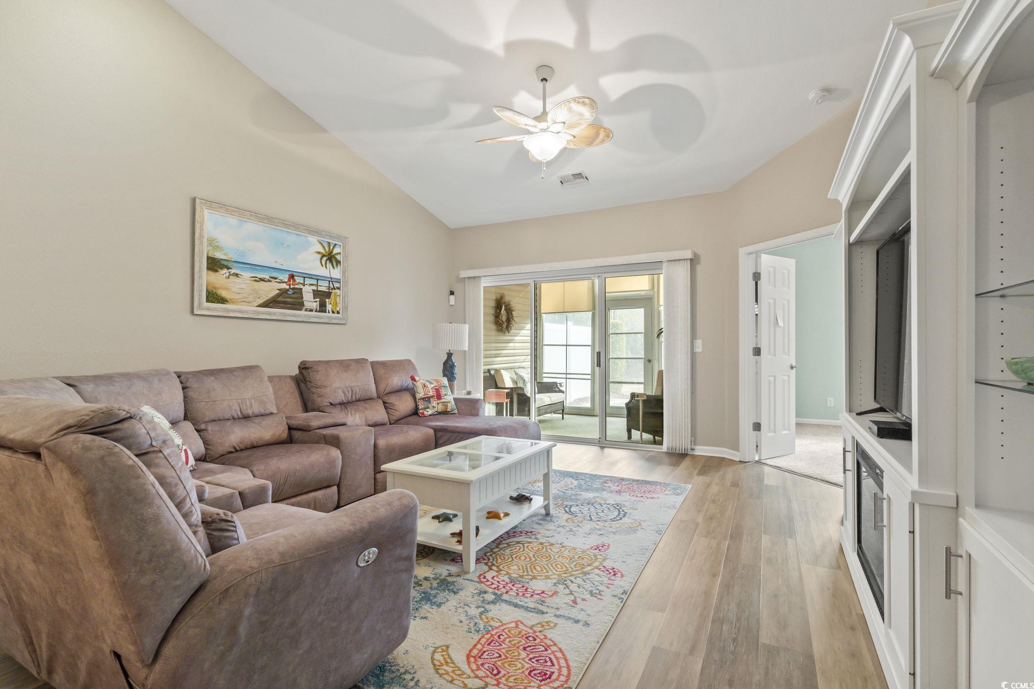 430 Woodpecker Lane, Unit D Murrells Inlet, SC 29576 - Photo 13 of 36 Living room featuring light wood finished floors and a ceiling fan