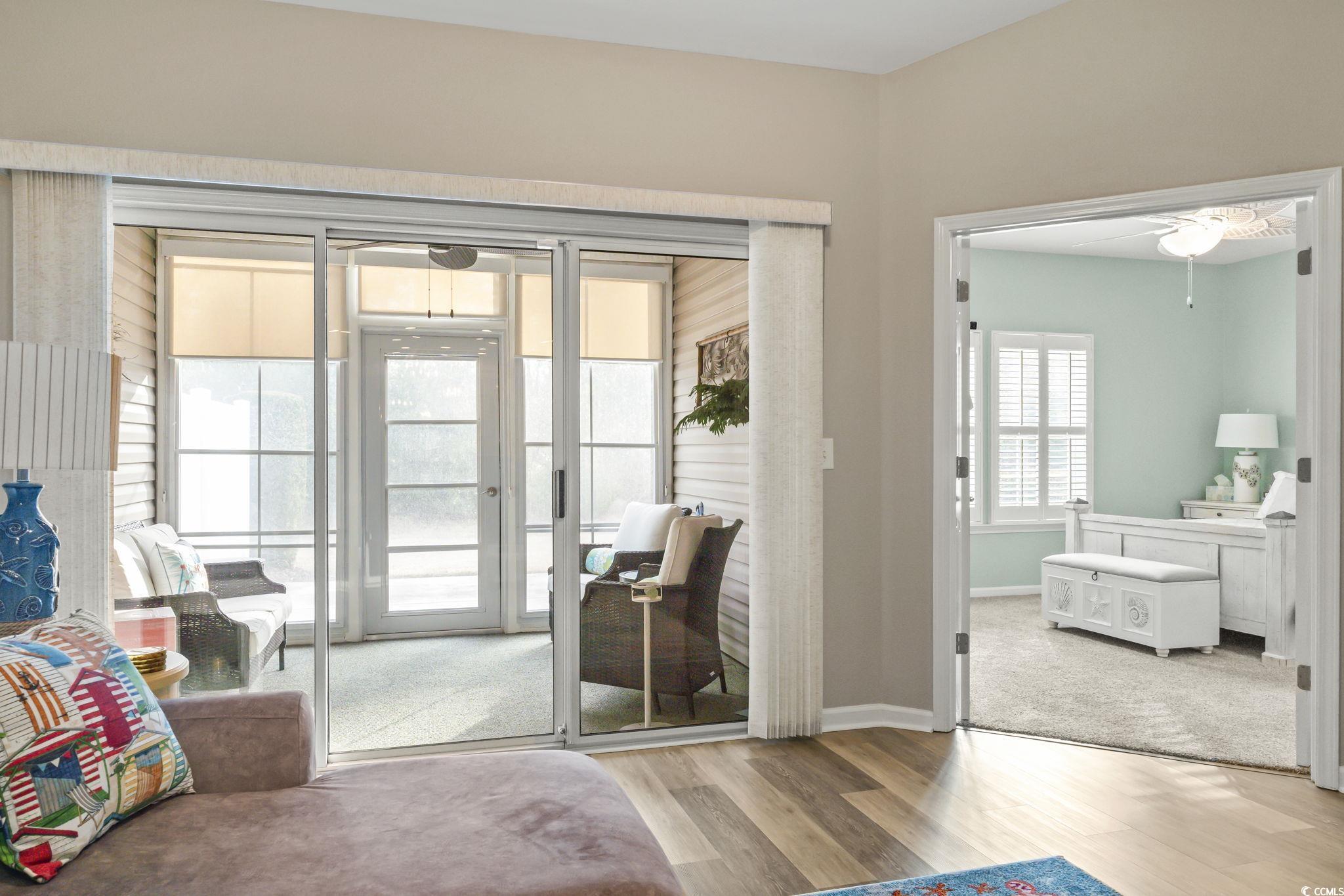 430 Woodpecker Lane, Unit D Murrells Inlet, SC 29576 - Photo 16 of 36 Living room featuring light wood finished floors and ceiling fan