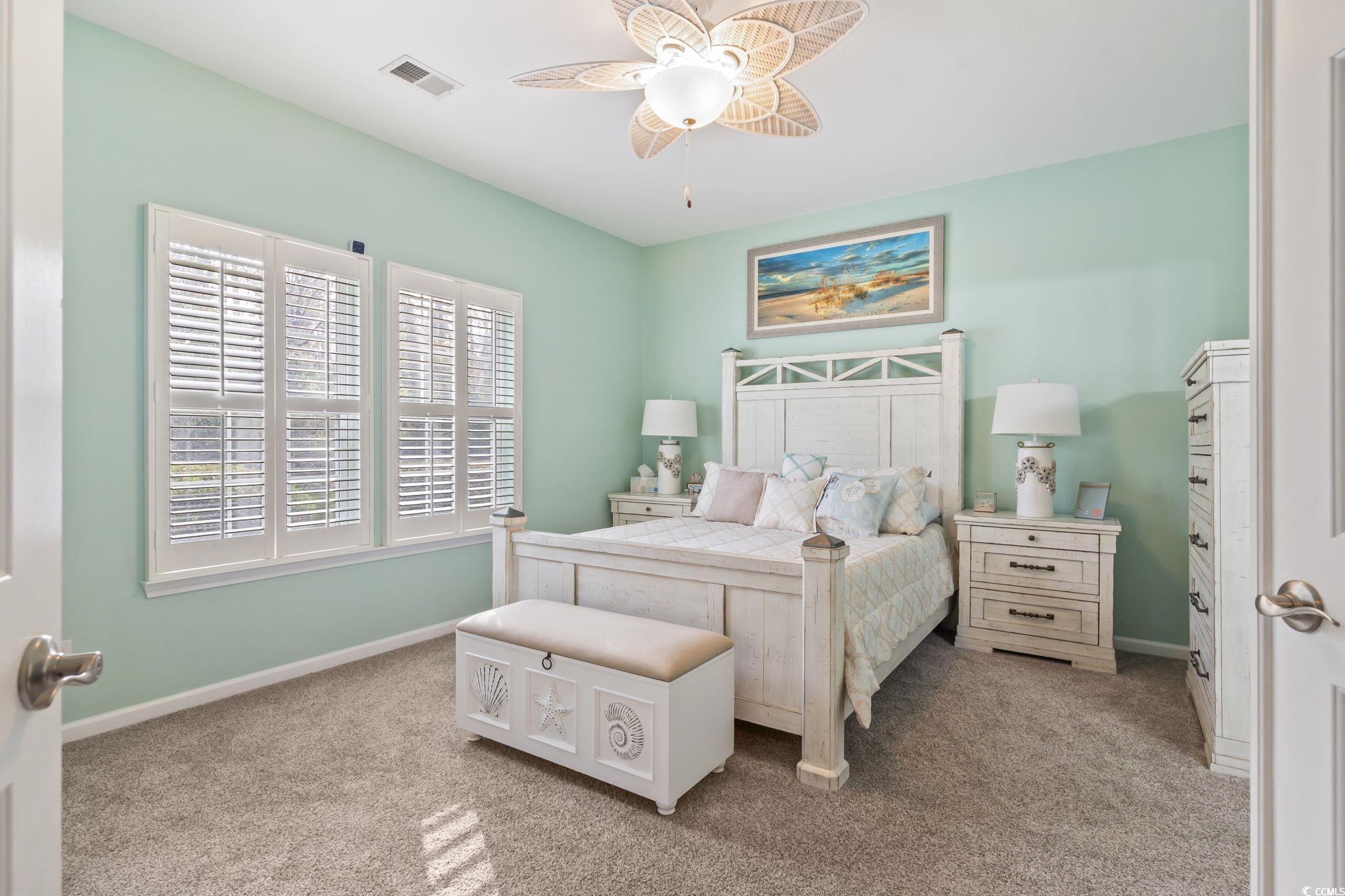 430 Woodpecker Lane, Unit D Murrells Inlet, SC 29576 - Photo 17 of 36 Bedroom with light carpet and a ceiling fan
