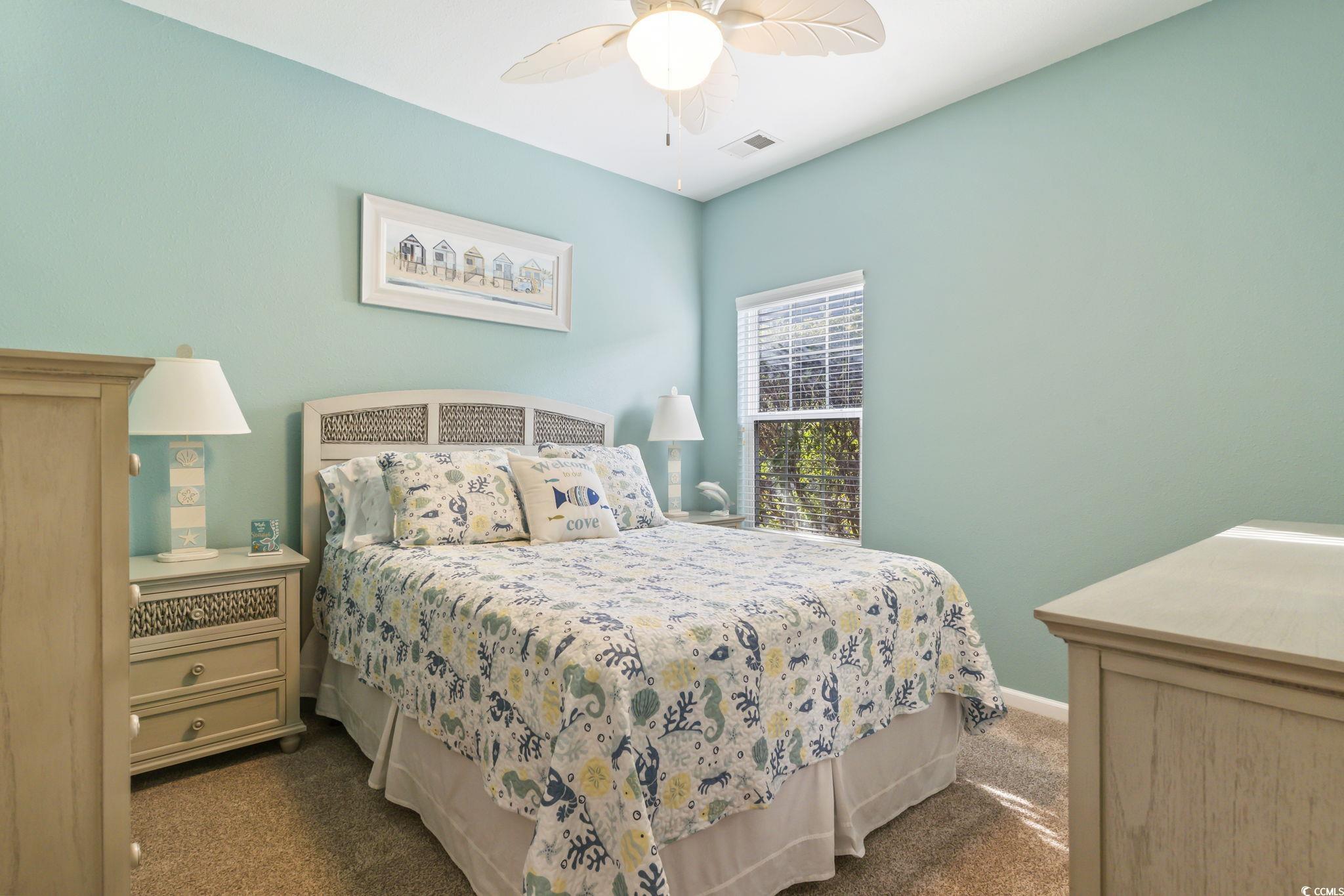 430 Woodpecker Lane, Unit D Murrells Inlet, SC 29576 - Photo 22 of 36 Bedroom featuring dark carpet and a ceiling fan