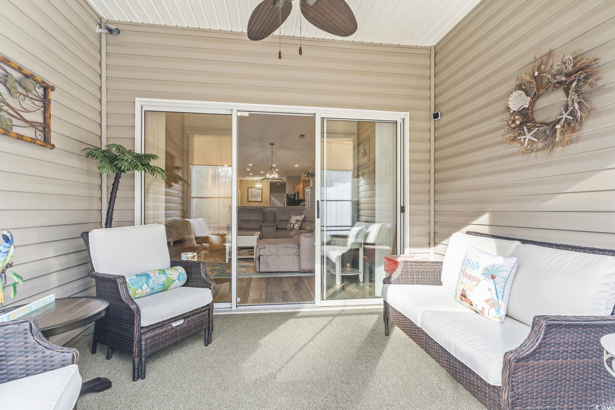 430 Woodpecker Lane, Unit D Murrells Inlet, SC 29576 - Photo 26 of 36 Sunroom / solarium featuring outdoor lounge area and ceiling fan