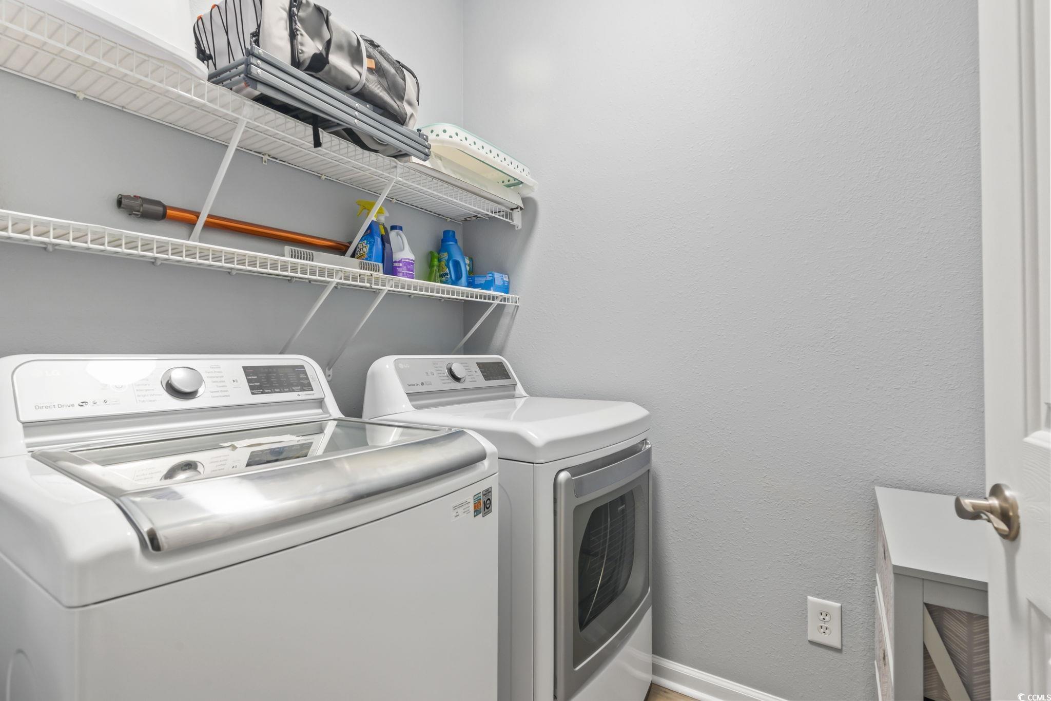 430 Woodpecker Lane, Unit D Murrells Inlet, SC 29576 - Photo 27 of 36 Washroom featuring washing machine and clothes dryer and a textured wall