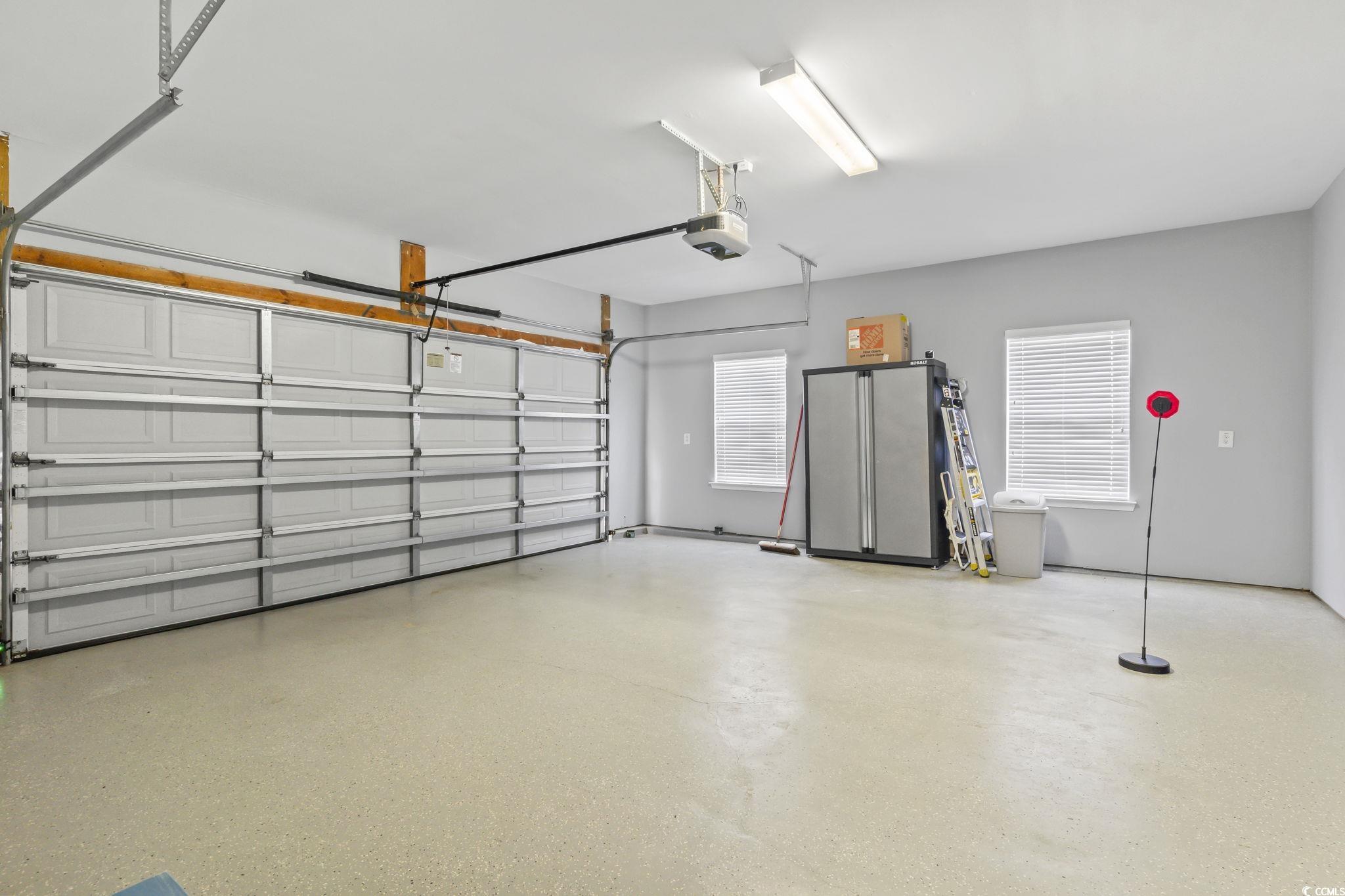 430 Woodpecker Lane, Unit D Murrells Inlet, SC 29576 - Photo 28 of 36 Garage with a garage door opener