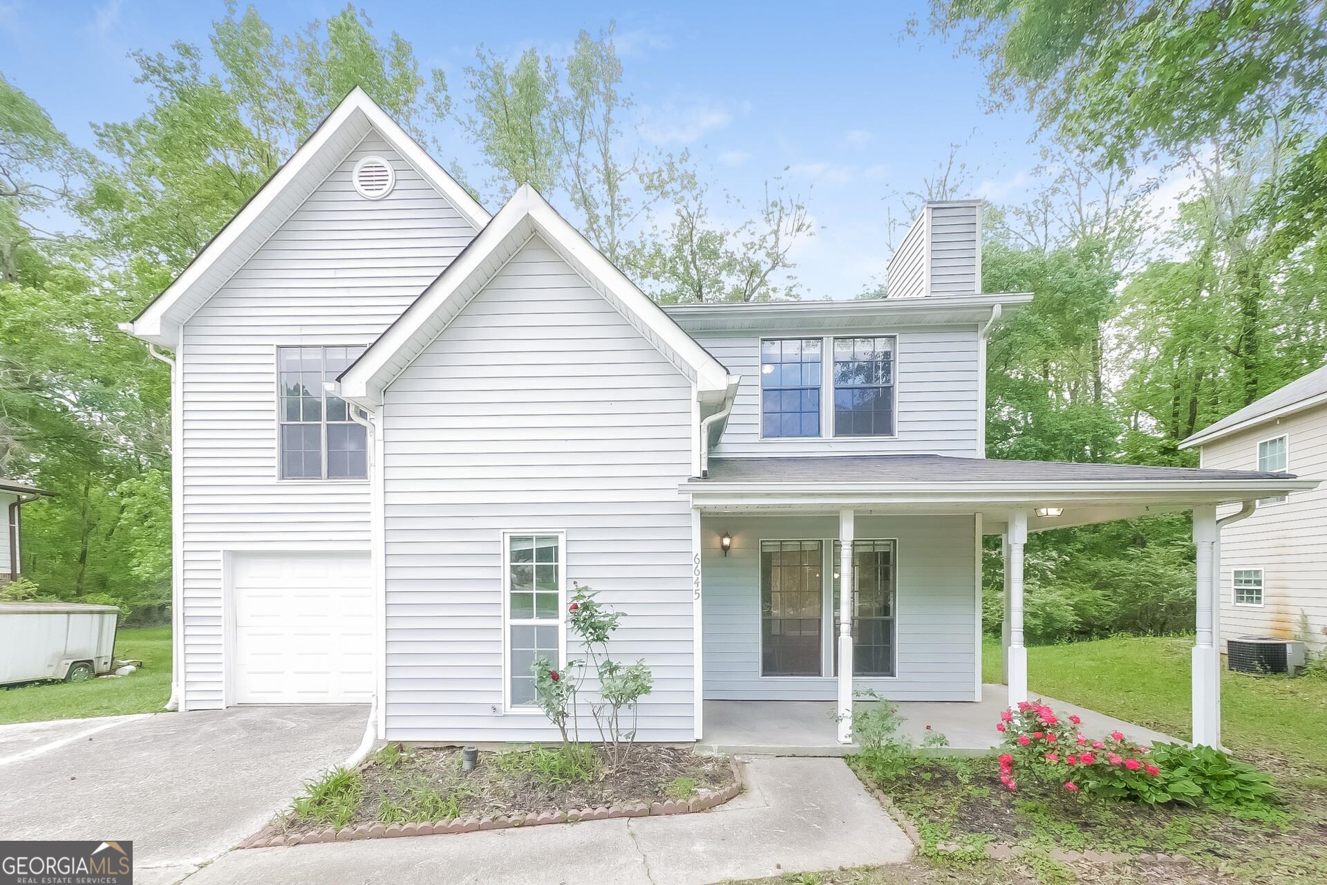 6645 Cameron Road Morrow, GA 30260 - Photo 1 of 17 a front view of a house with garden