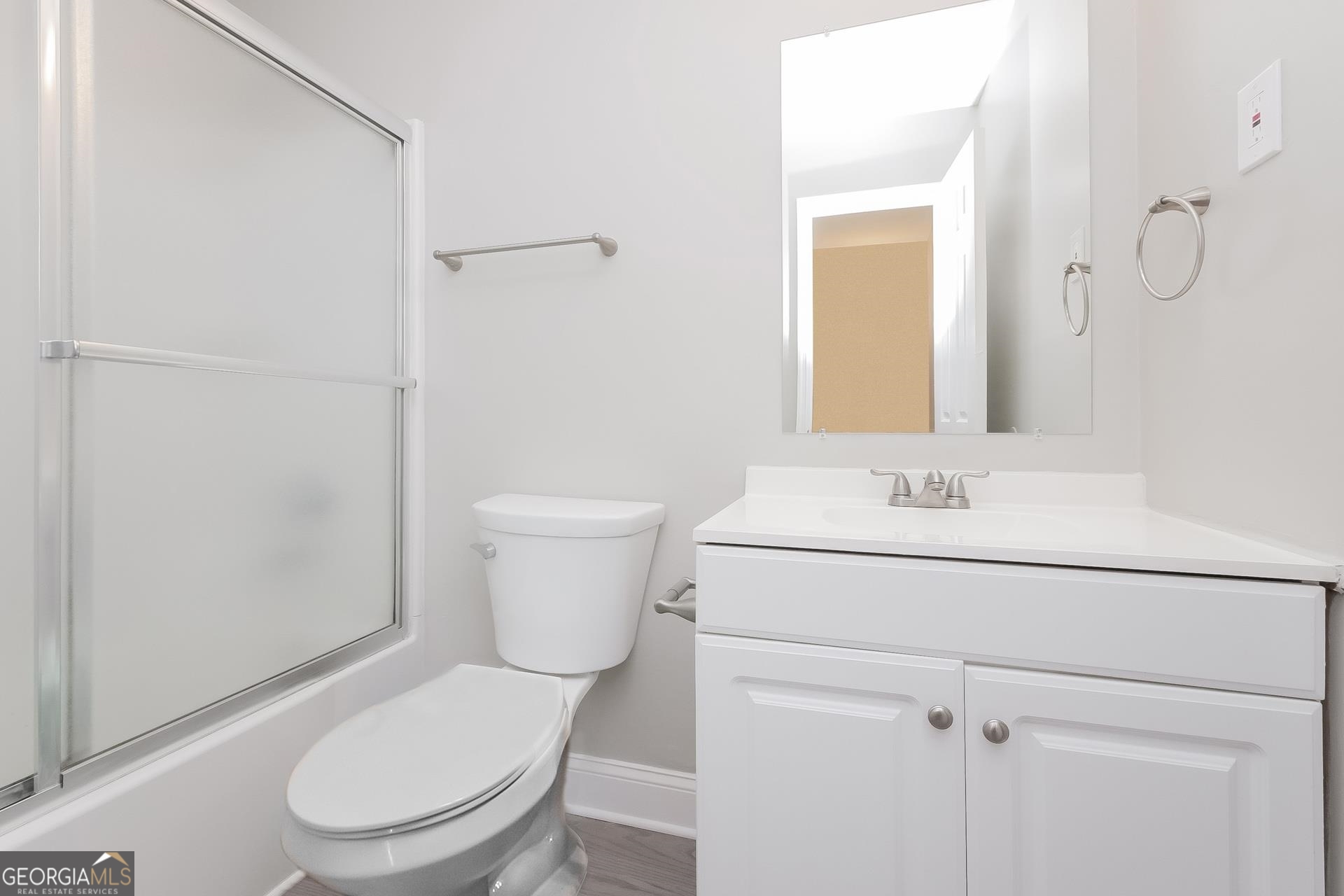 6645 Cameron Road Morrow, GA 30260 - Photo 11 of 17 a white toilet sitting next to a bathroom sink