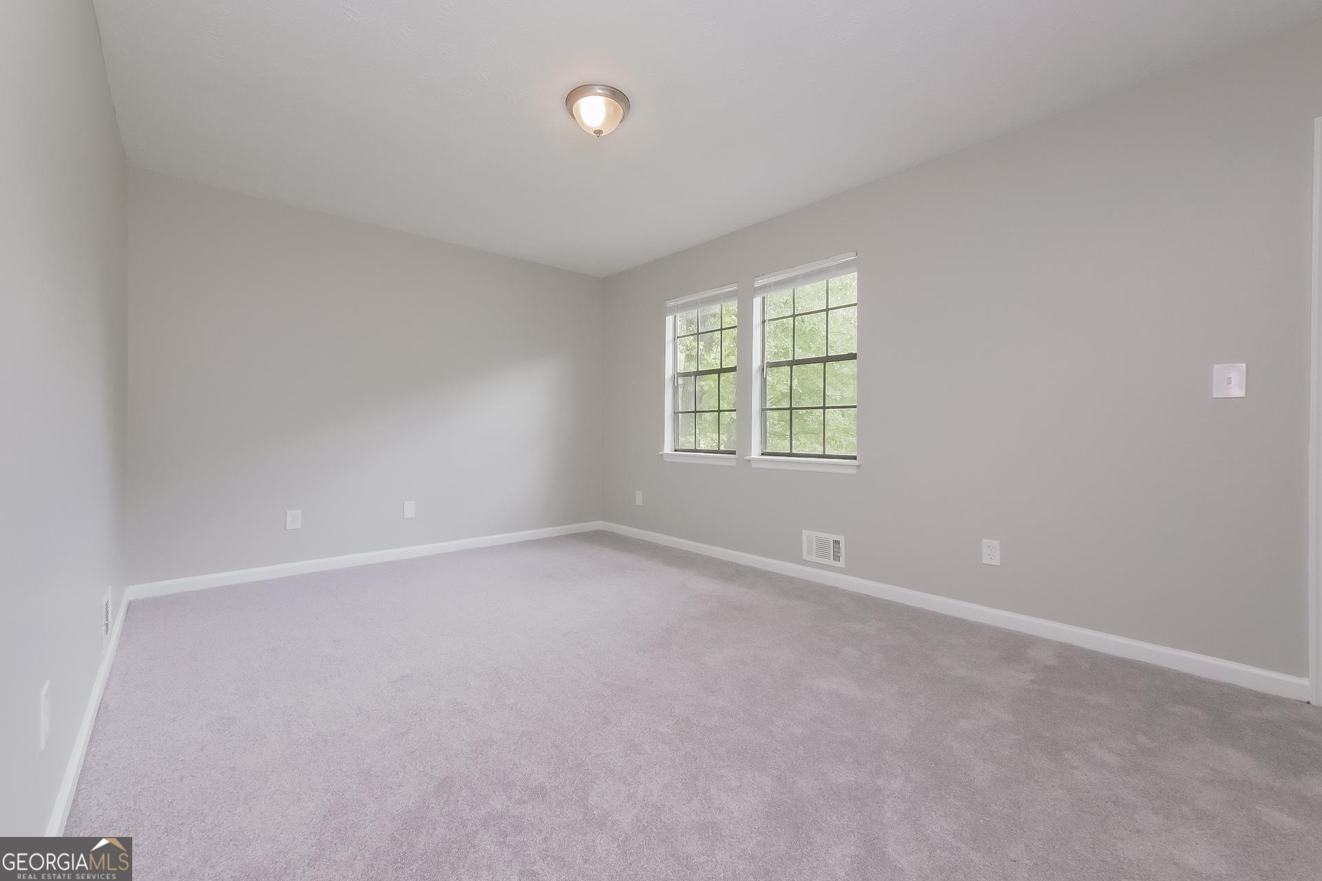 6645 Cameron Road Morrow, GA 30260 - Photo 13 of 17 an empty room with windows
