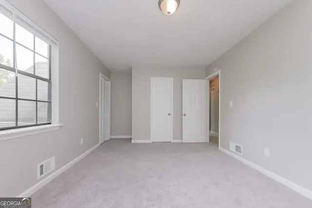 an empty room with windows