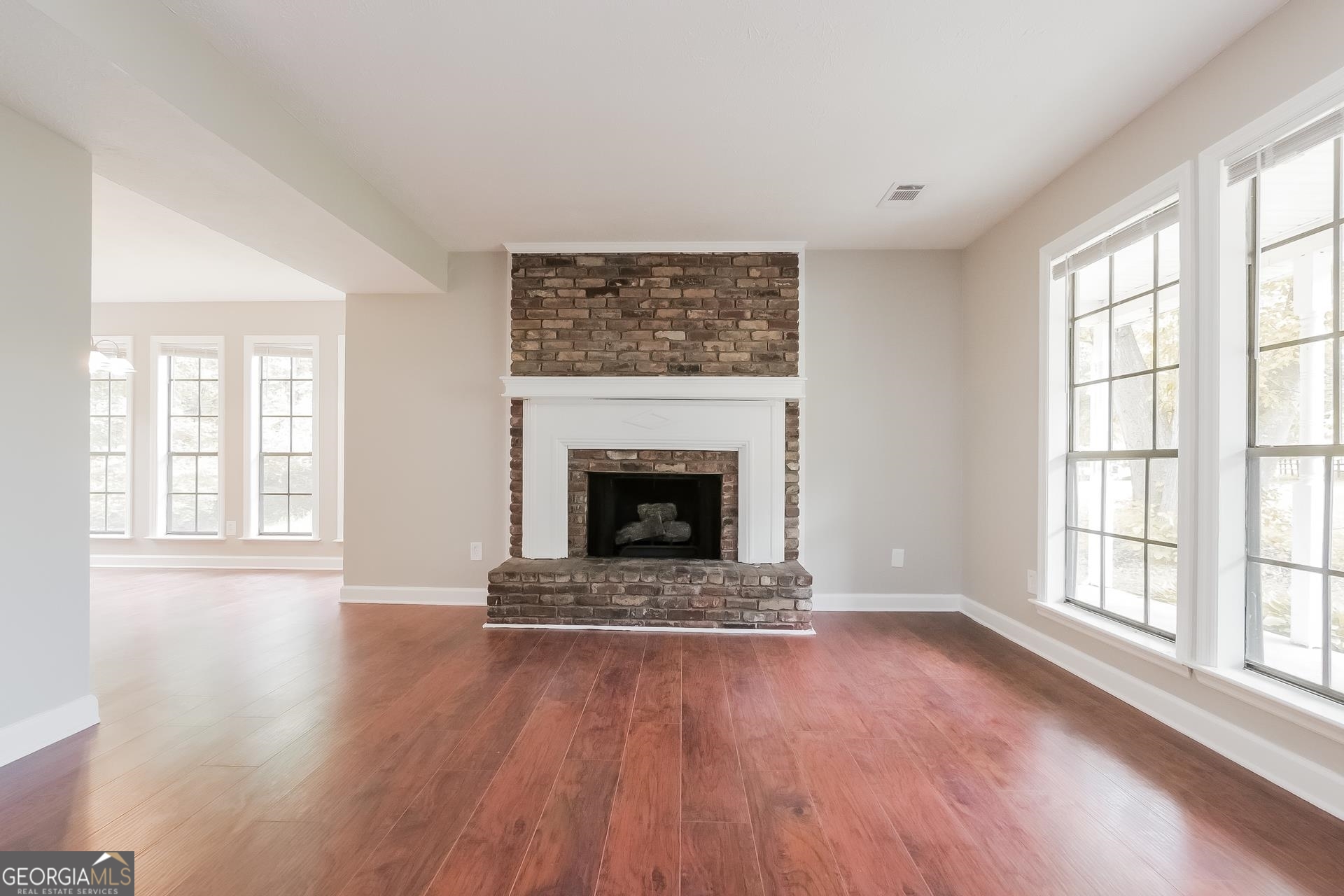 6645 Cameron Road Morrow, GA 30260 - Photo 5 of 17 wooden floor fireplace and windows in an empty room
