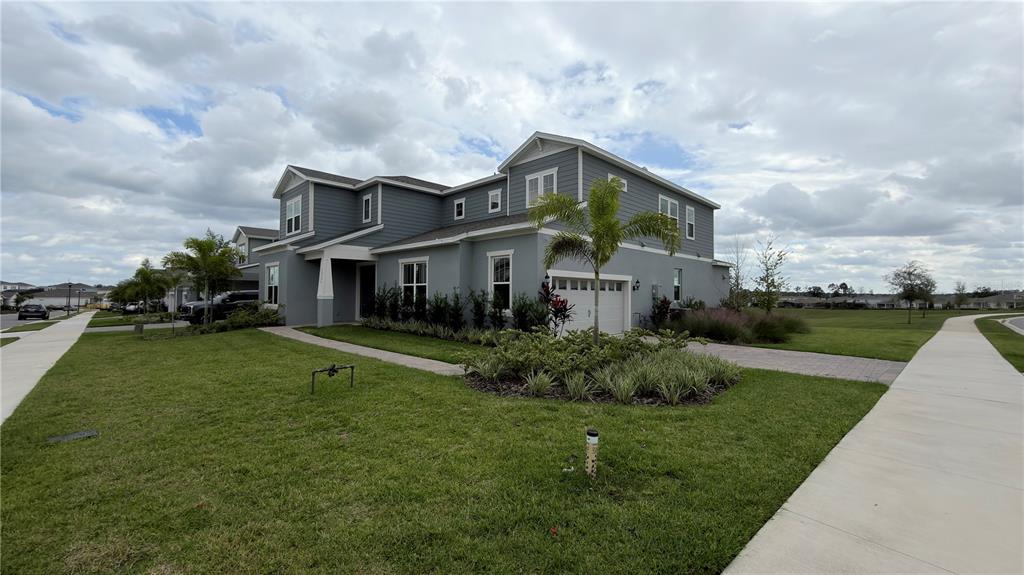 15295 Rising Vw Drive Montverde, FL 34756 - Photo 1 of 50 a front view of a house with a garden