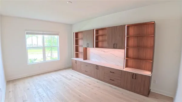 a view of an empty room with a window