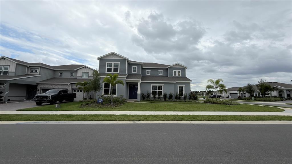15295 Rising Vw Drive Montverde, FL 34756 - Photo 2 of 50 a view of a big house with a big yard and large trees