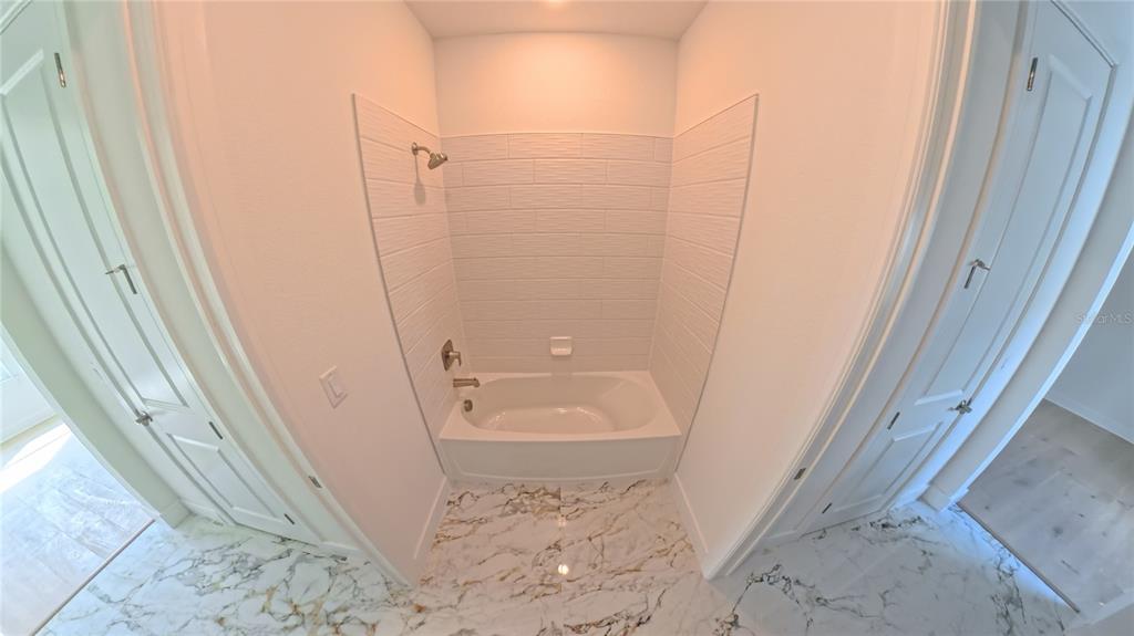 15295 Rising Vw Drive Montverde, FL 34756 - Photo 30 of 50 a bathroom with a tub