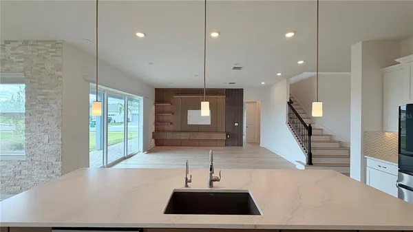 a kitchen with sink and window