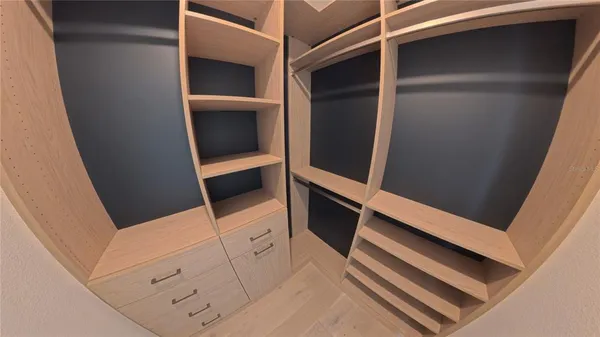 a view of a bathroom with wooden floor
