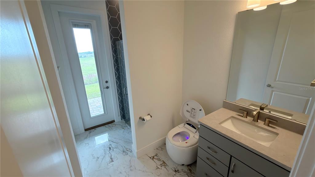 15295 Rising Vw Drive Montverde, FL 34756 - Photo 41 of 50 a bathroom with a sink and a mirror