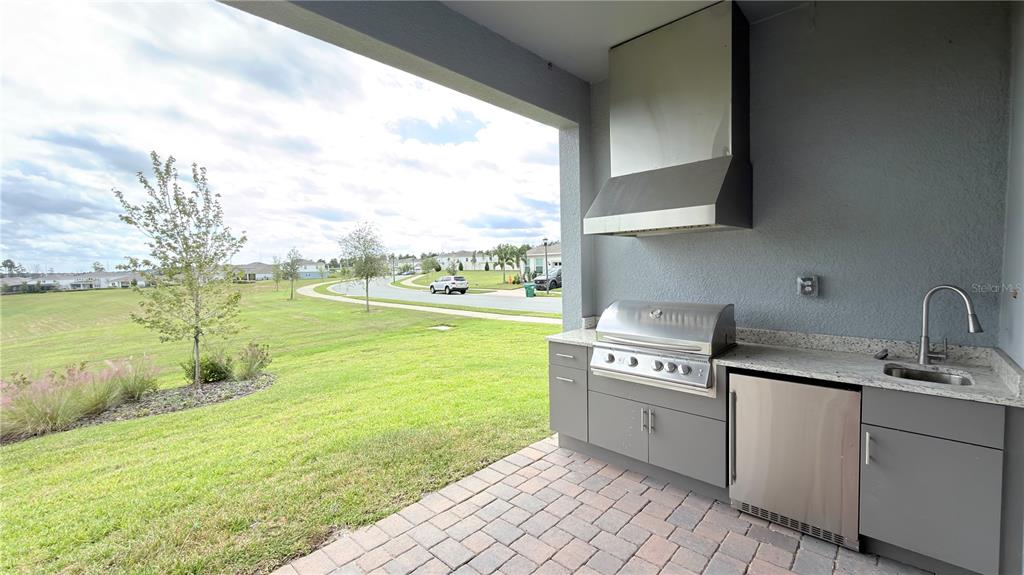 15295 Rising Vw Drive Montverde, FL 34756 - Photo 43 of 50 a kitchen with a stove a sink and a next to a window