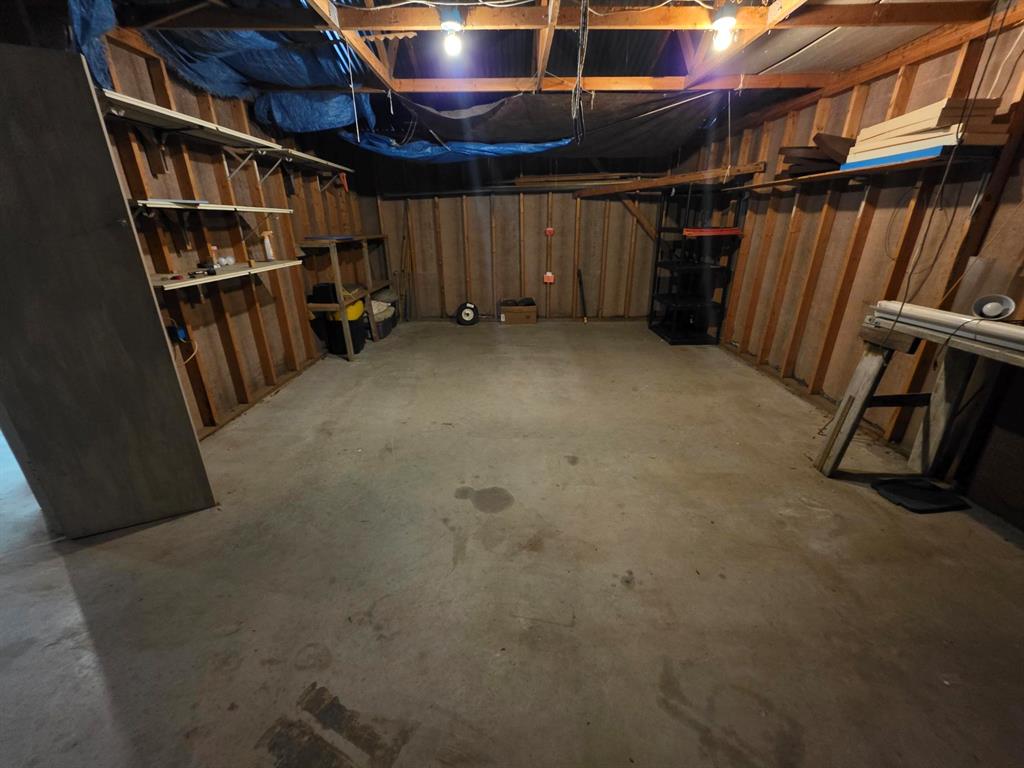 3872 East State Highway 154 Quitman, TX 75783 - Photo 15 of 40 a view of an empty room with furniture and a book shelf