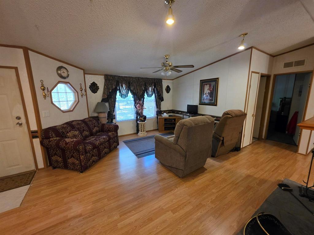 3872 East State Highway 154 Quitman, TX 75783 - Photo 25 of 40 a living room with furniture and a large window