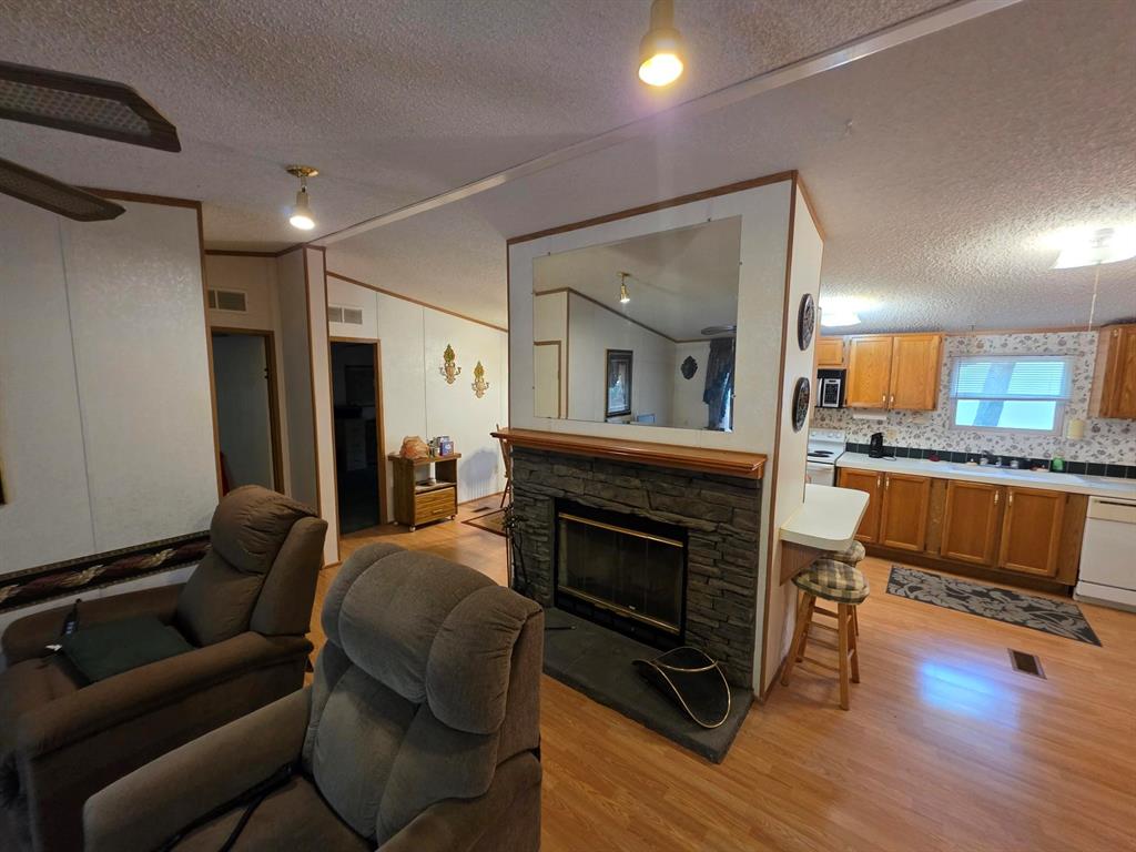 3872 East State Highway 154 Quitman, TX 75783 - Photo 26 of 40 a living room with furniture and a fireplace