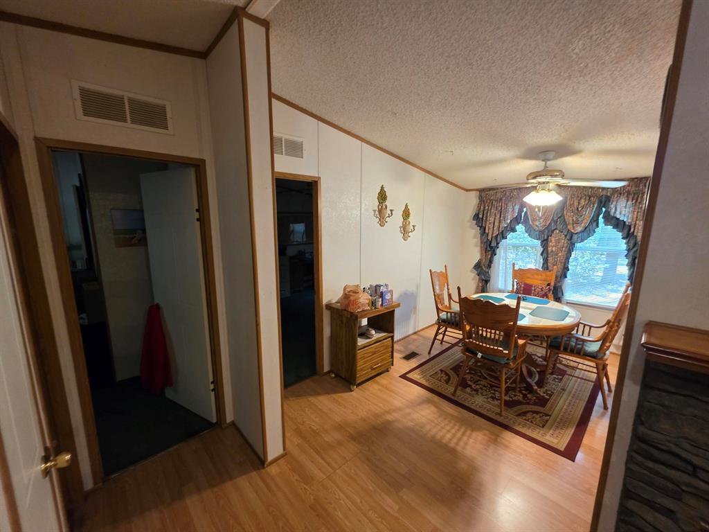 3872 East State Highway 154 Quitman, TX 75783 - Photo 27 of 40 a living room with furniture and a wooden floor