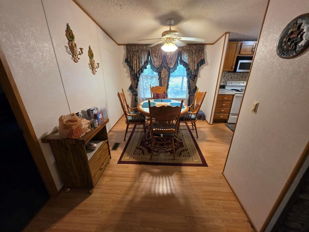 3872 East State Highway 154 Quitman, TX 75783 - Photo 29 of 40 a view of a dining room with furniture and wooden floor