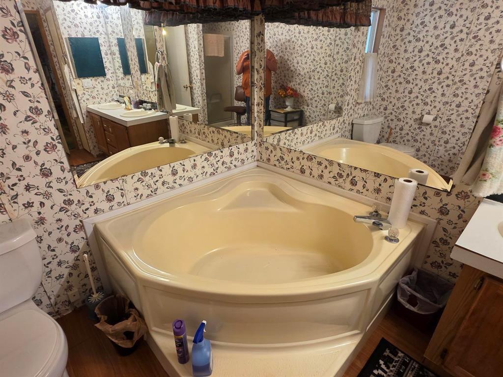 3872 East State Highway 154 Quitman, TX 75783 - Photo 33 of 40 a bath tub sitting next to a white toilet