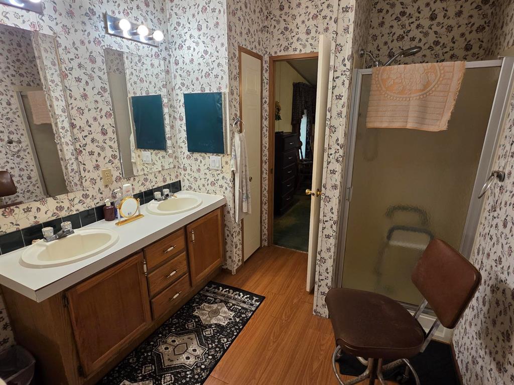 3872 East State Highway 154 Quitman, TX 75783 - Photo 34 of 40 a bathroom with a double vanity sink mirror and toilet