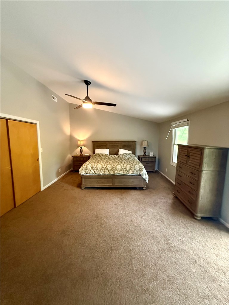 1200 Loran Pointe Circle Seneca, SC 29672 - Photo 20 of 29 This spacious bedroom offers comfortable living with a bright window and soft carpeting.