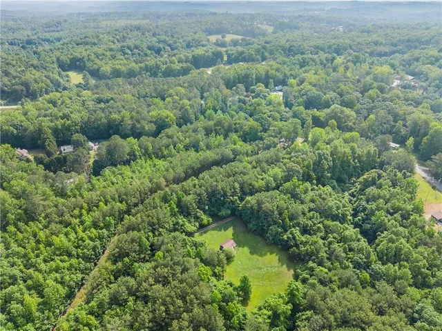 a view of a field with an ocean