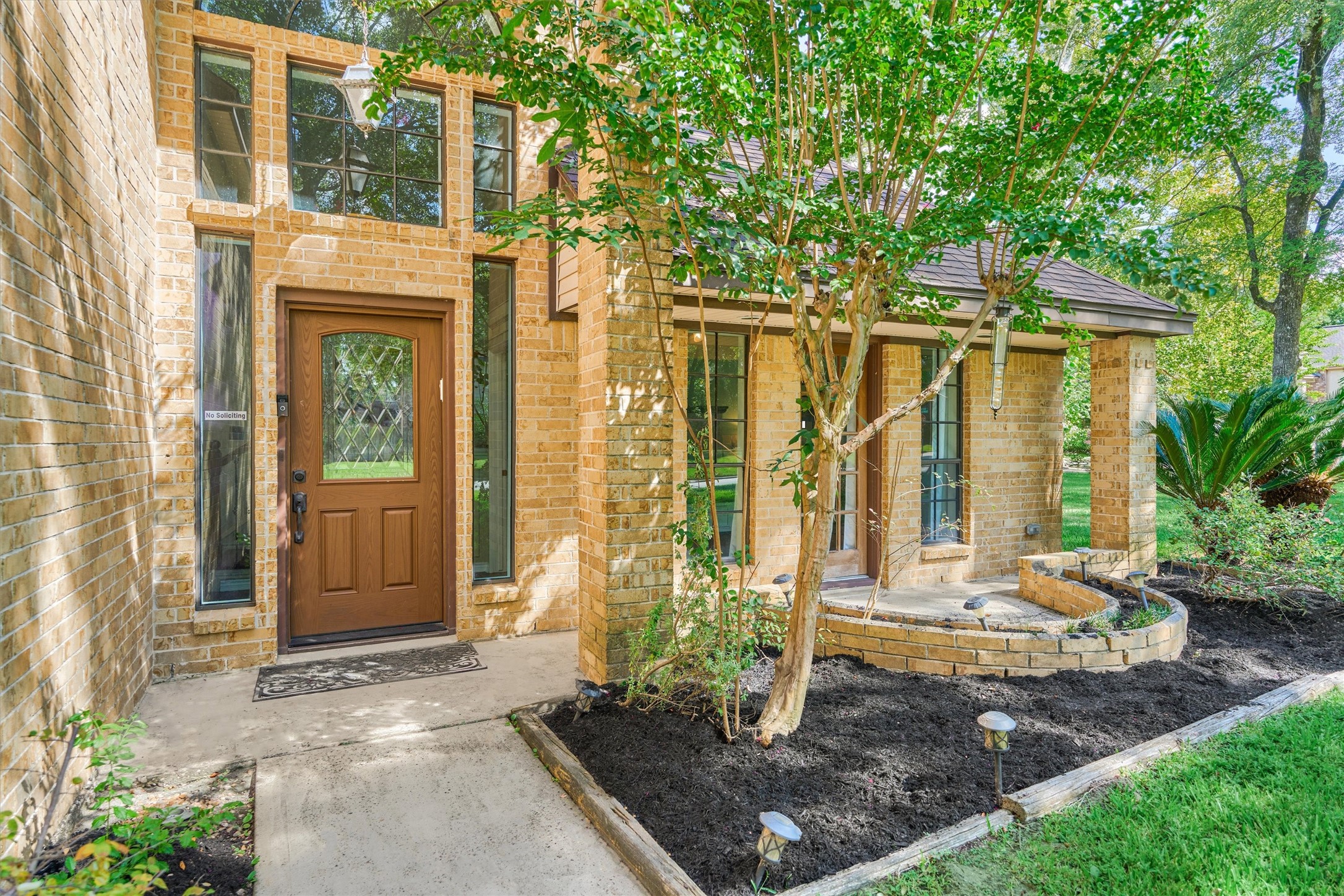 25706 Overlake Drive Spring, TX 77380 - Photo 4 of 32 Inviting front entrance with elegant door, stunning windows, and fresh landscaping.