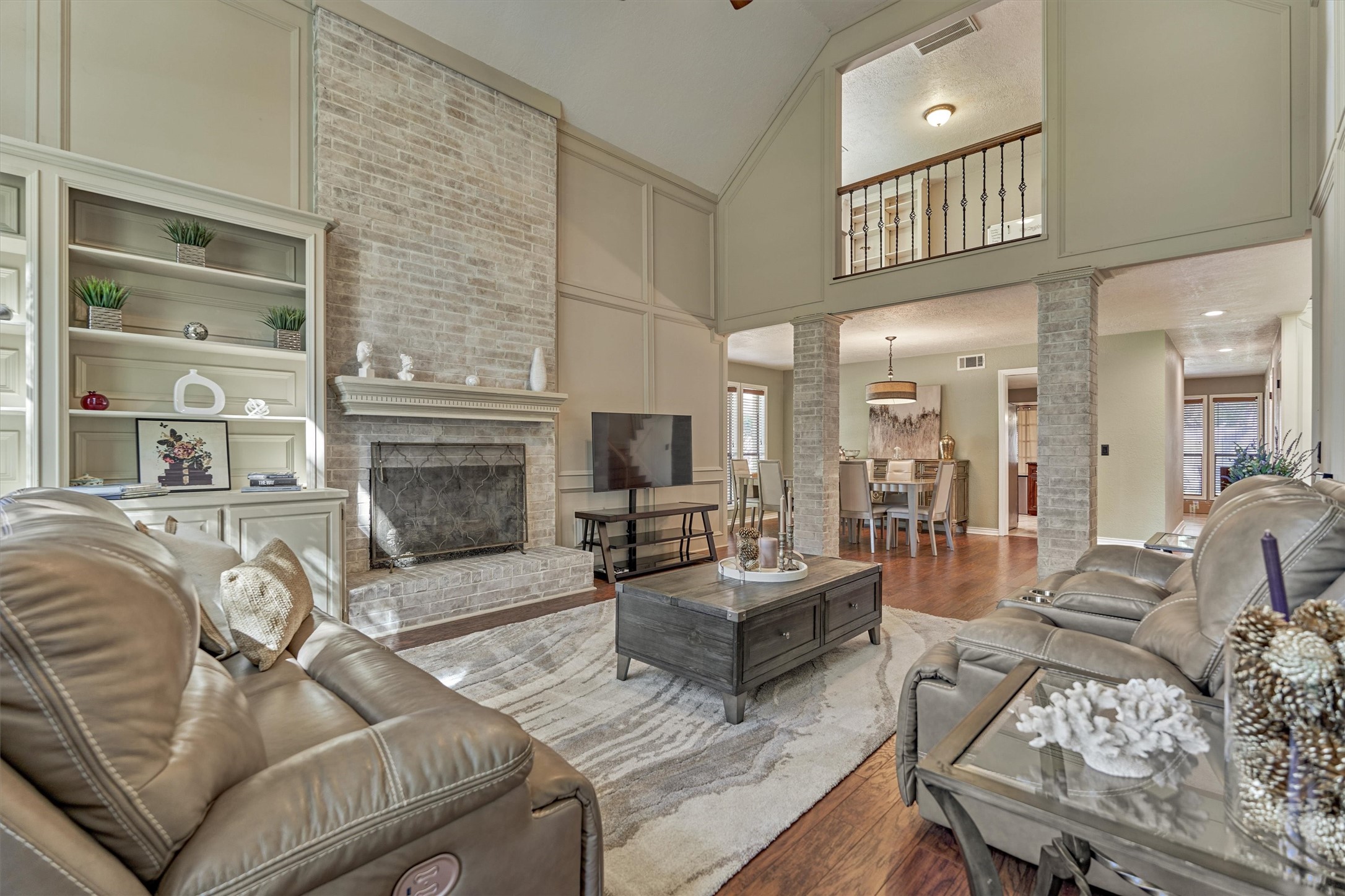 25706 Overlake Drive Spring, TX 77380 - Photo 8 of 32 Cozy central fireplace perfect for entertaining in style.