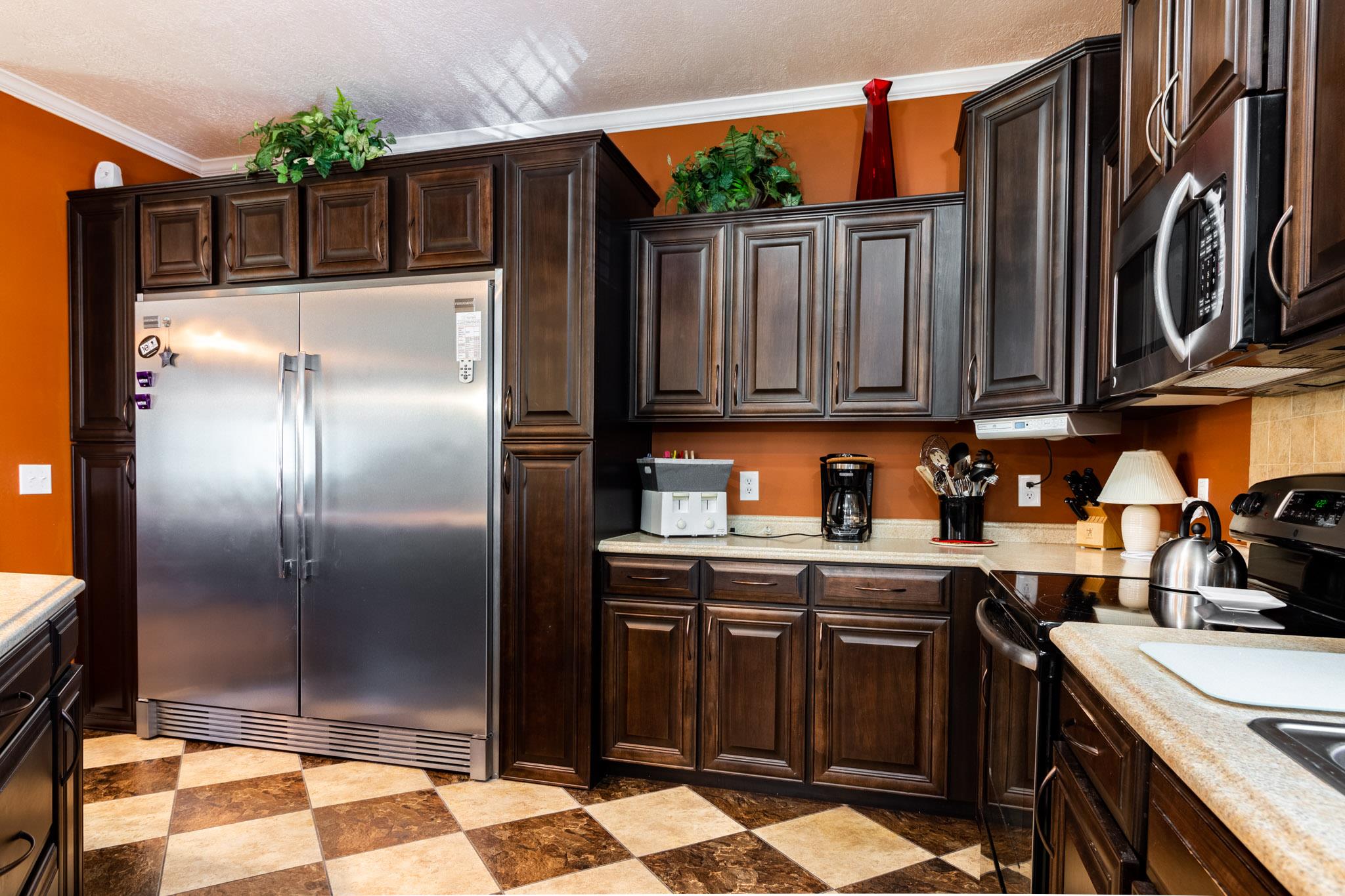 588 York Hollow Road Pulaski, TN 38478 - Photo 4 of 16 a kitchen with stainless steel appliances granite countertop a refrigerator and a stove top oven