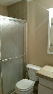 174 Excell Road Clarksville, TN 37043 - Photo 8 of 10 a white toilet sitting next to a bathroom sink