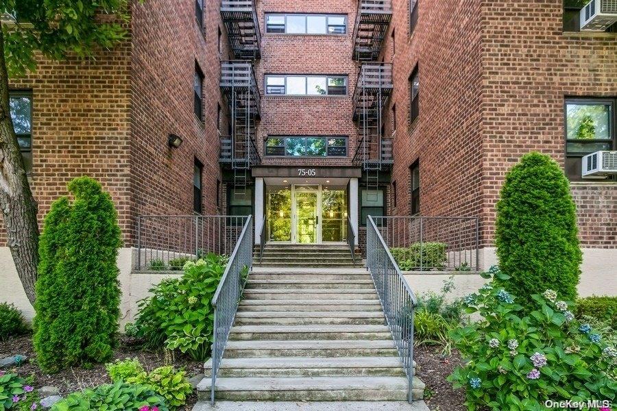 75-05 210th Street, Unit 2P Queens, NY 11364 - Photo 2 of 20 a view of a pathway both side of building