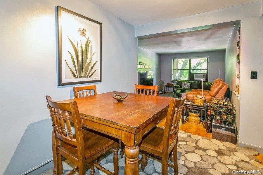 75-05 210th Street, Unit 2P Queens, NY 11364 - Photo 8 of 20 a dining room with furniture and window
