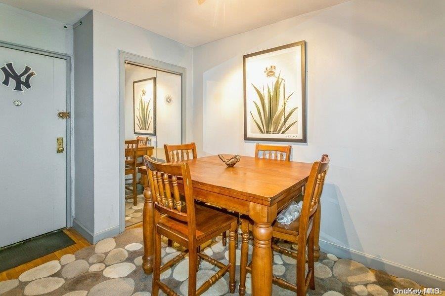 75-05 210th Street, Unit 2P Queens, NY 11364 - Photo 9 of 20 a dining room with furniture and window