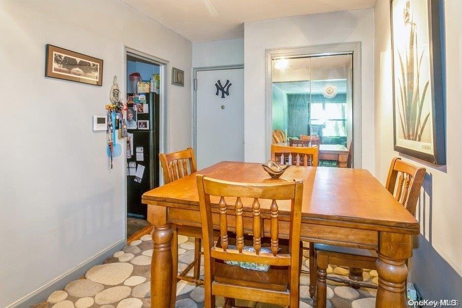 75-05 210th Street, Unit 2P Queens, NY 11364 - Photo 10 of 20 a dining room with furniture and window
