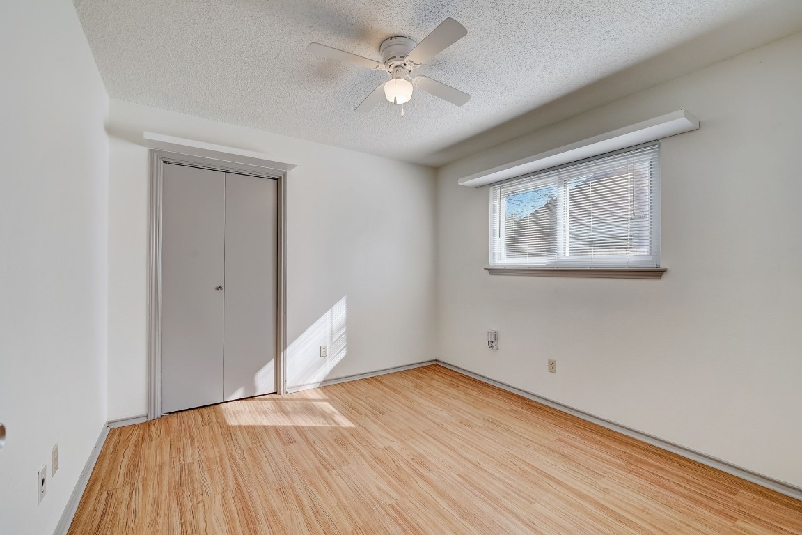 1709 Goodson Lane Round Rock, TX 78664 - Photo 19 of 37 wooden floor in an empty room with a window