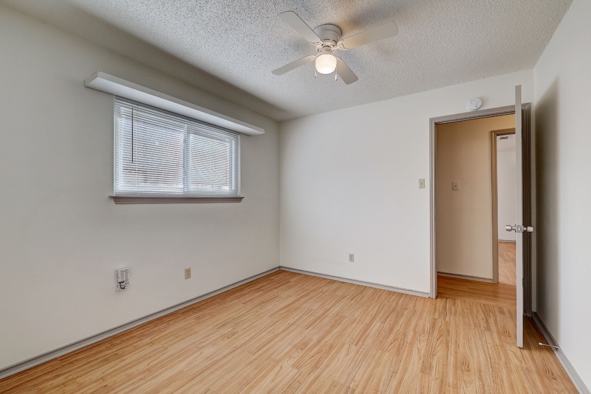1709 Goodson Lane Round Rock, TX 78664 - Photo 20 of 37 a view of empty room with wooden floor and fan