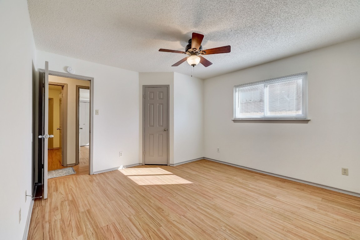 1709 Goodson Lane Round Rock, TX 78664 - Photo 23 of 37 a view of empty room with wooden floor and fan