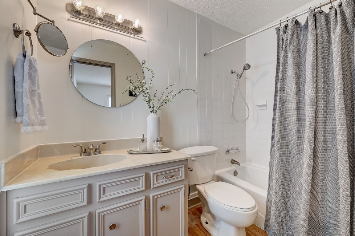 1709 Goodson Lane Round Rock, TX 78664 - Photo 25 of 37 a bathroom with a granite countertop sink toilet and shower