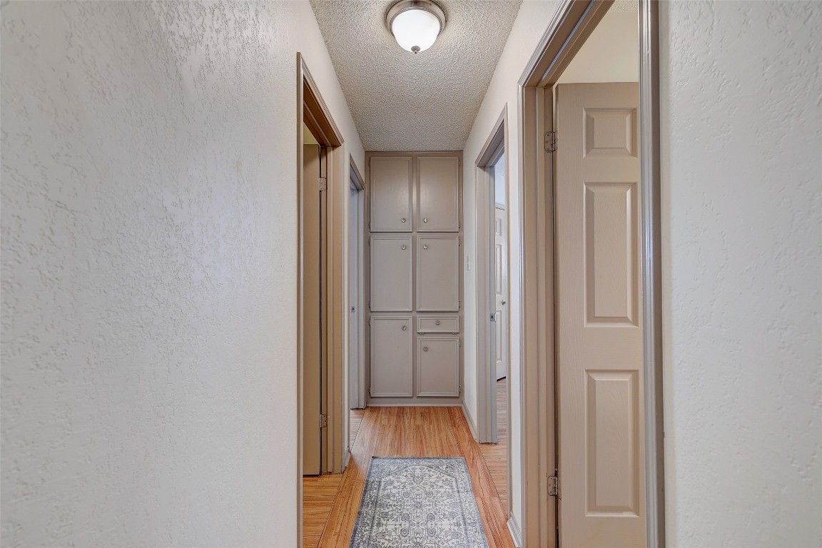 1709 Goodson Lane Round Rock, TX 78664 - Photo 28 of 37 a view of hallway with walk in closet and wooden floor