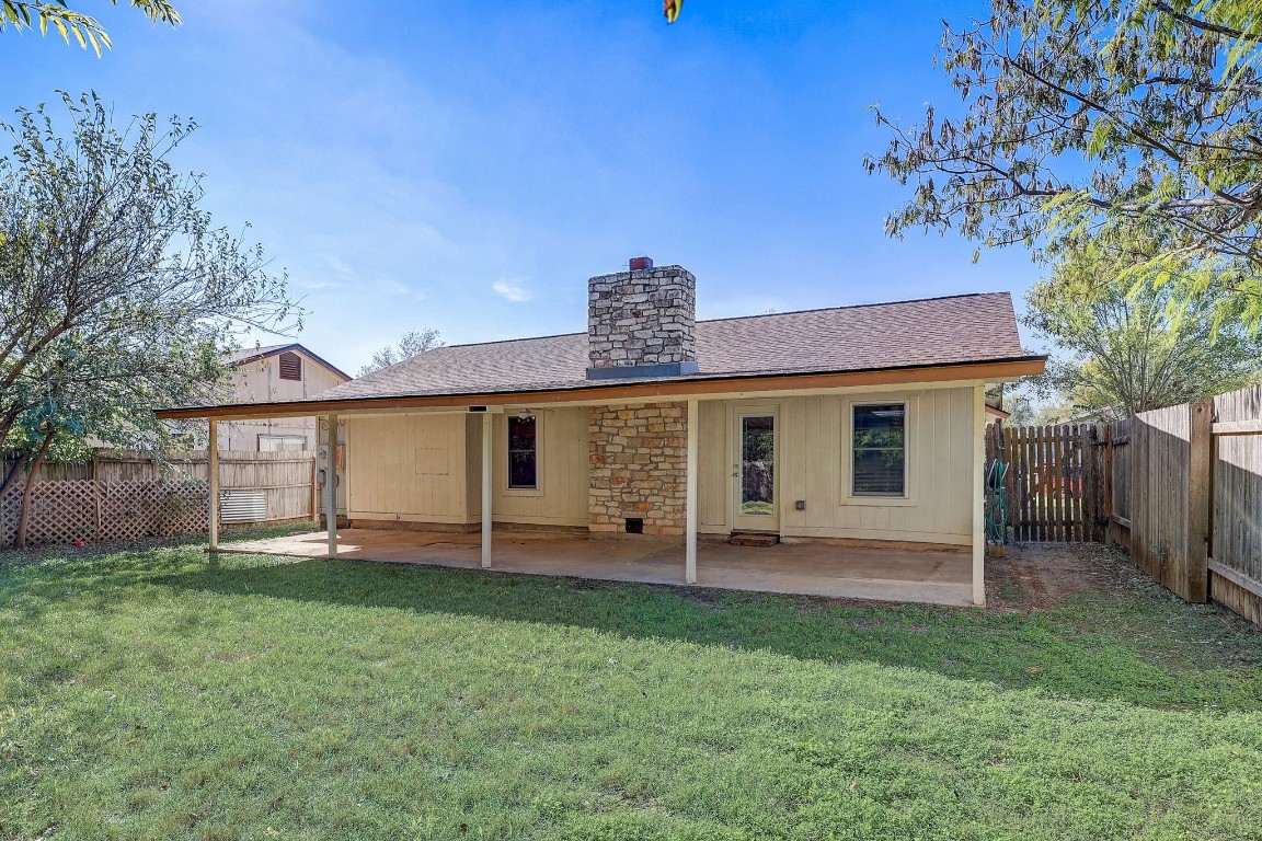1709 Goodson Lane Round Rock, TX 78664 - Photo 32 of 37 a view of a house with a yard and wooden fence