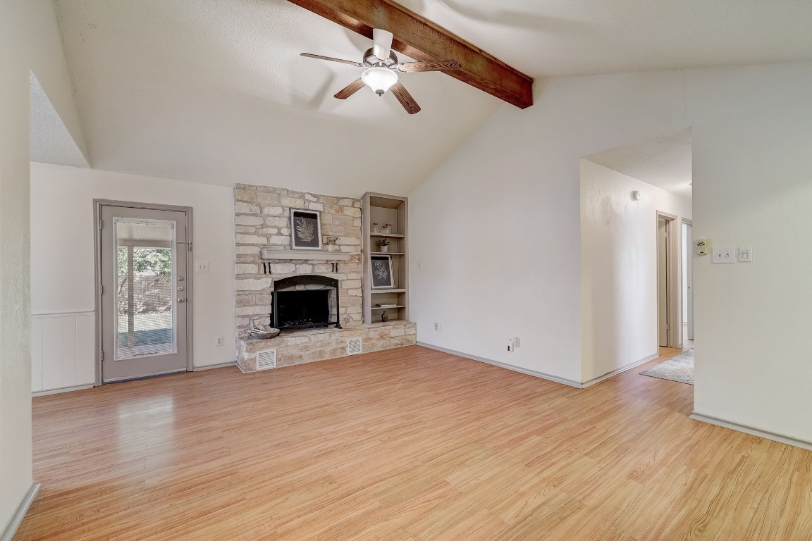 1709 Goodson Lane Round Rock, TX 78664 - Photo 7 of 37 a view of empty room with fireplace and wooden floor