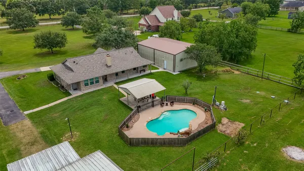 an aerial view of a house with outdoor space