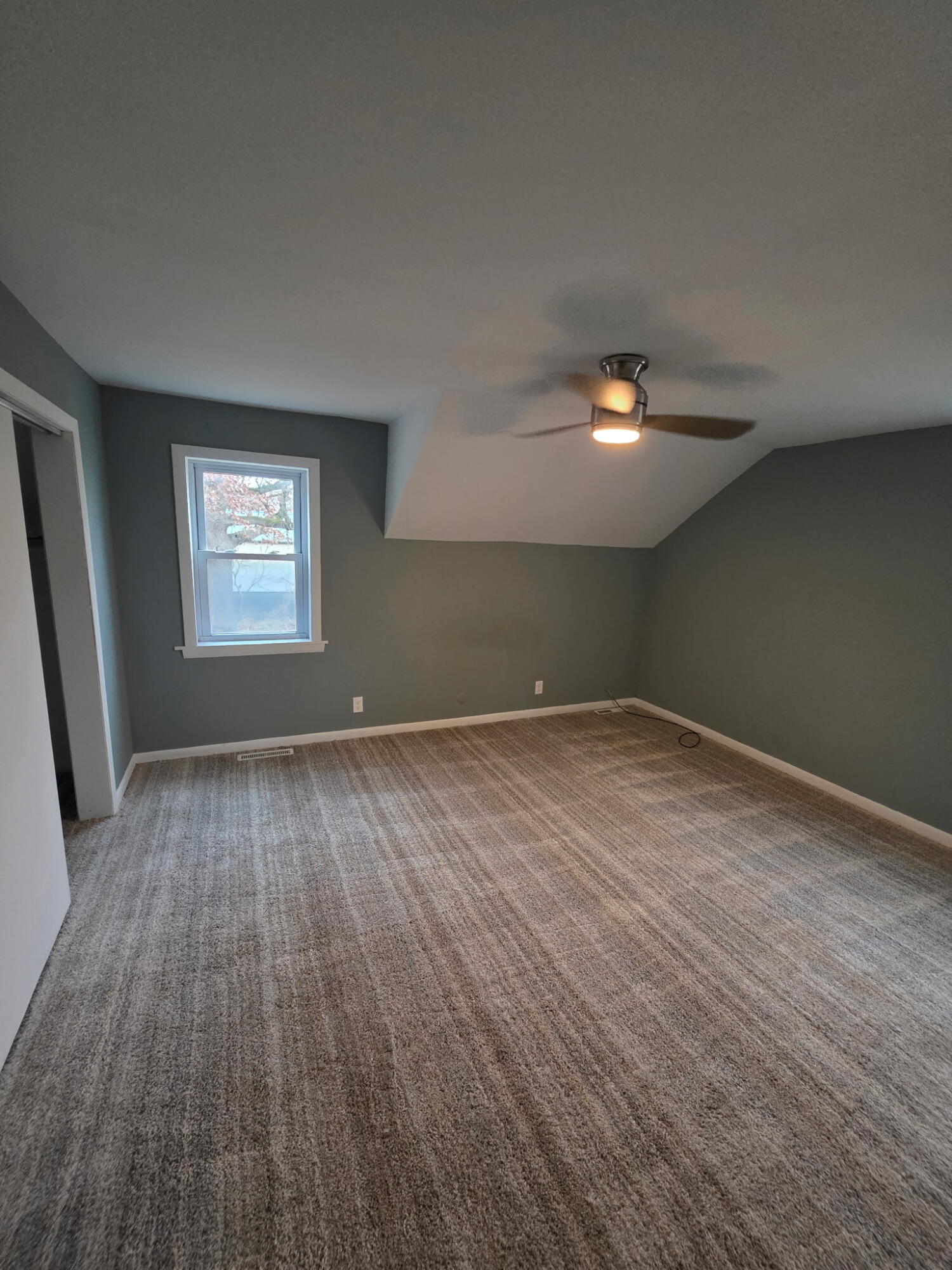 1033 Reder Road Griffith, IN 46319 - Photo 16 of 20 an empty room with wooden floor and windows