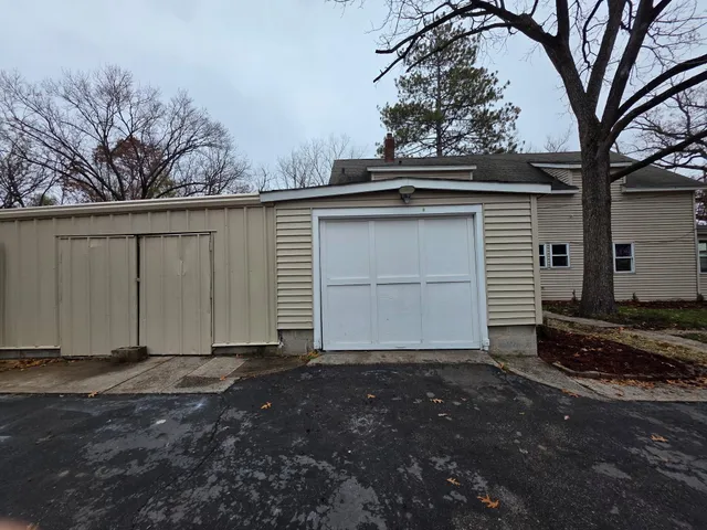 a view of a house with a tree